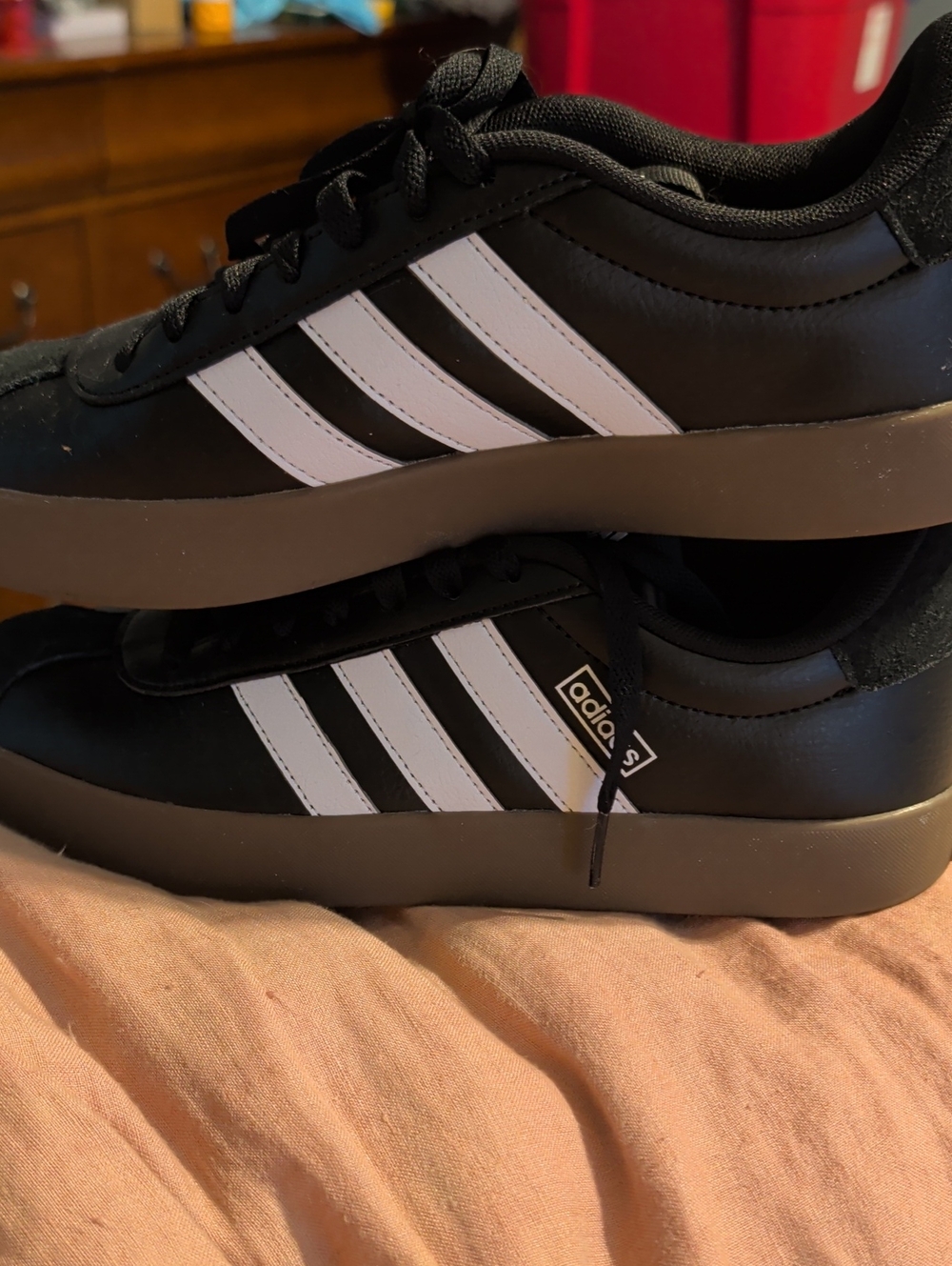adidas Black Sneakers with White Three-Stripes and Brown Sole